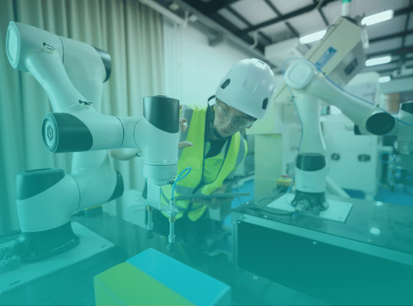 manufacturer employee working with robotic arm